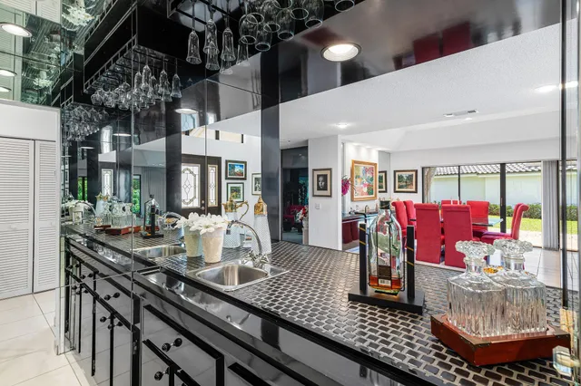 a living room with furniture and a ceiling fan