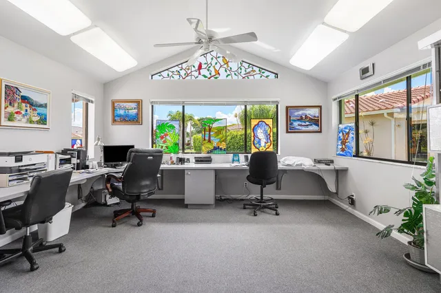 an aerial view of a house with yard swimming pool and outdoor seating