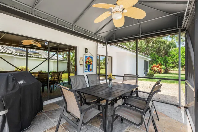 an aerial view of residential houses with outdoor space and swimming pool