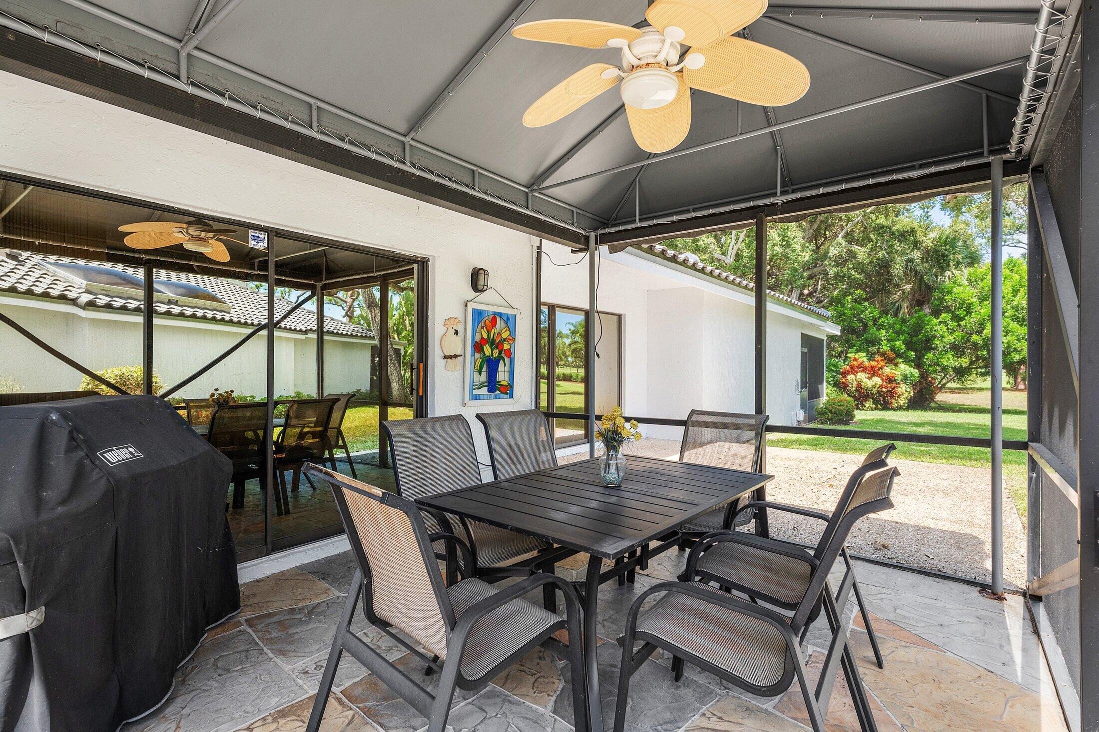 56 Woods Lane Boynton Beach, FL 33436 - Photo 37 of 77 a view of an outdoor dining space with furniture