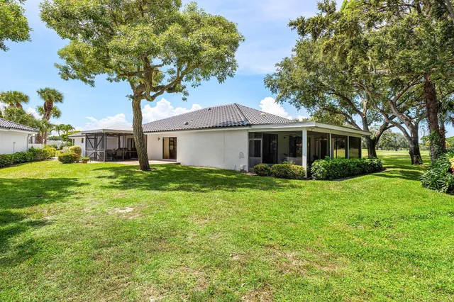 an aerial view of a houses with a lake and lake view