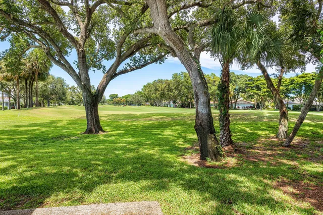 a living room filled with furniture and a large window