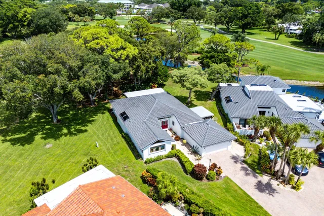 a view of a lake with houses in the back