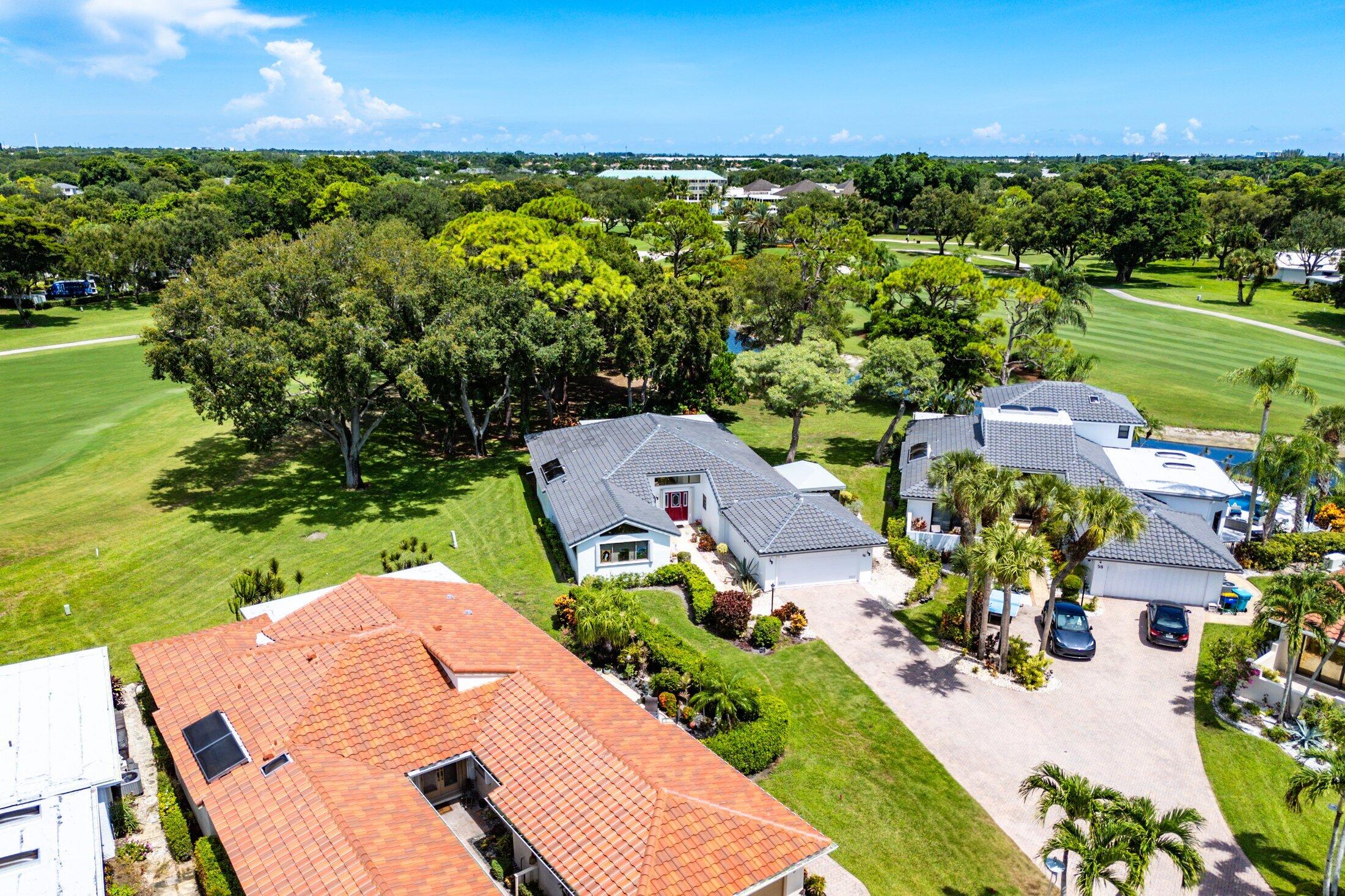 56 Woods Lane Boynton Beach, FL 33436 - Photo 49 of 77 an aerial view of a house with a yard