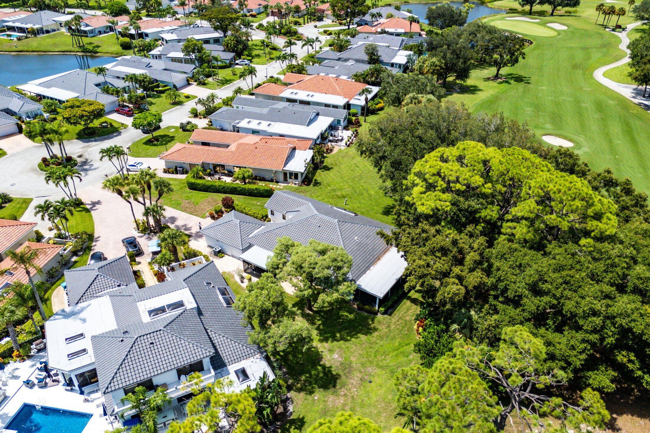 56 Woods Lane Boynton Beach, FL 33436 - Photo 54 of 77 an aerial view of residential houses with outdoor space and swimming pool
