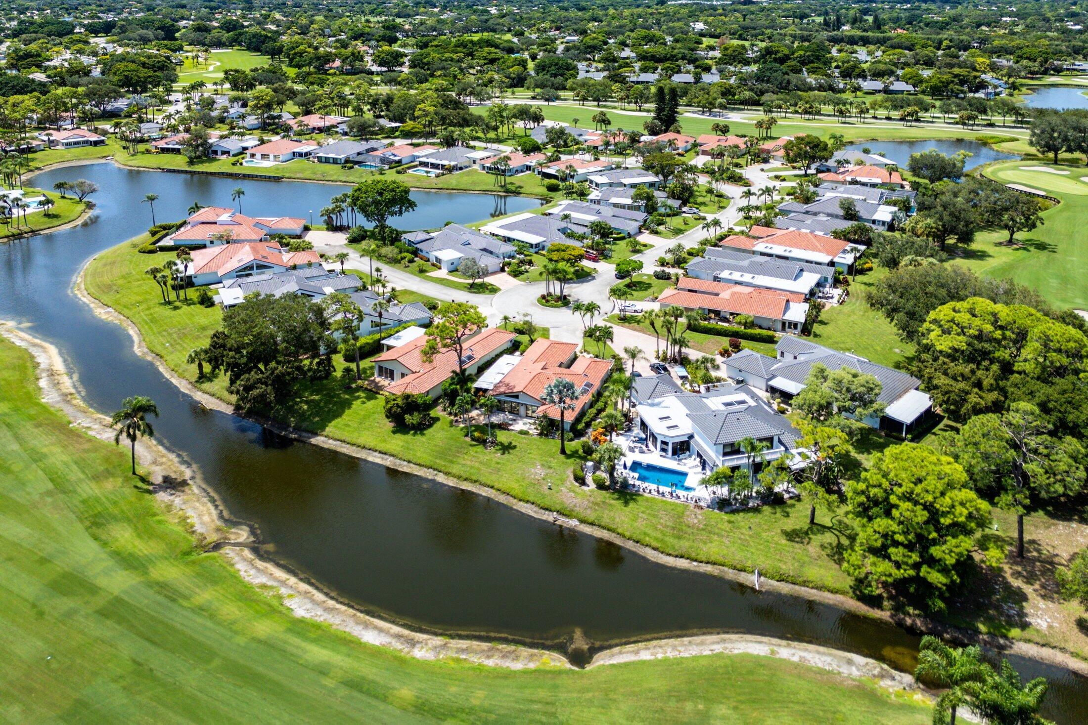 56 Woods Lane Boynton Beach, FL 33436 - Photo 56 of 77 an aerial view of residential houses with outdoor space and swimming pool