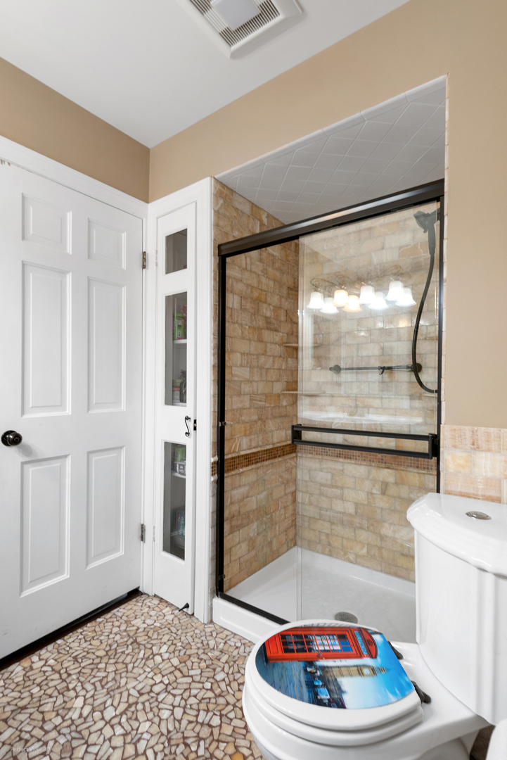 32-w050 Cedar Lane Wayne, IL 60184 - Photo 27 of 38 a bathroom with a sink and a shower