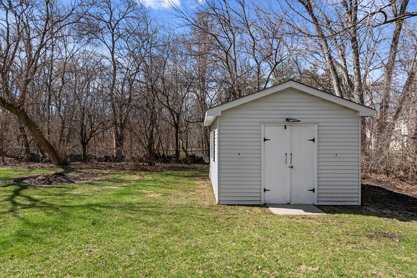 32-w050 Cedar Lane Wayne, IL 60184 - Photo 30 of 38 a front view of house with yard and trees
