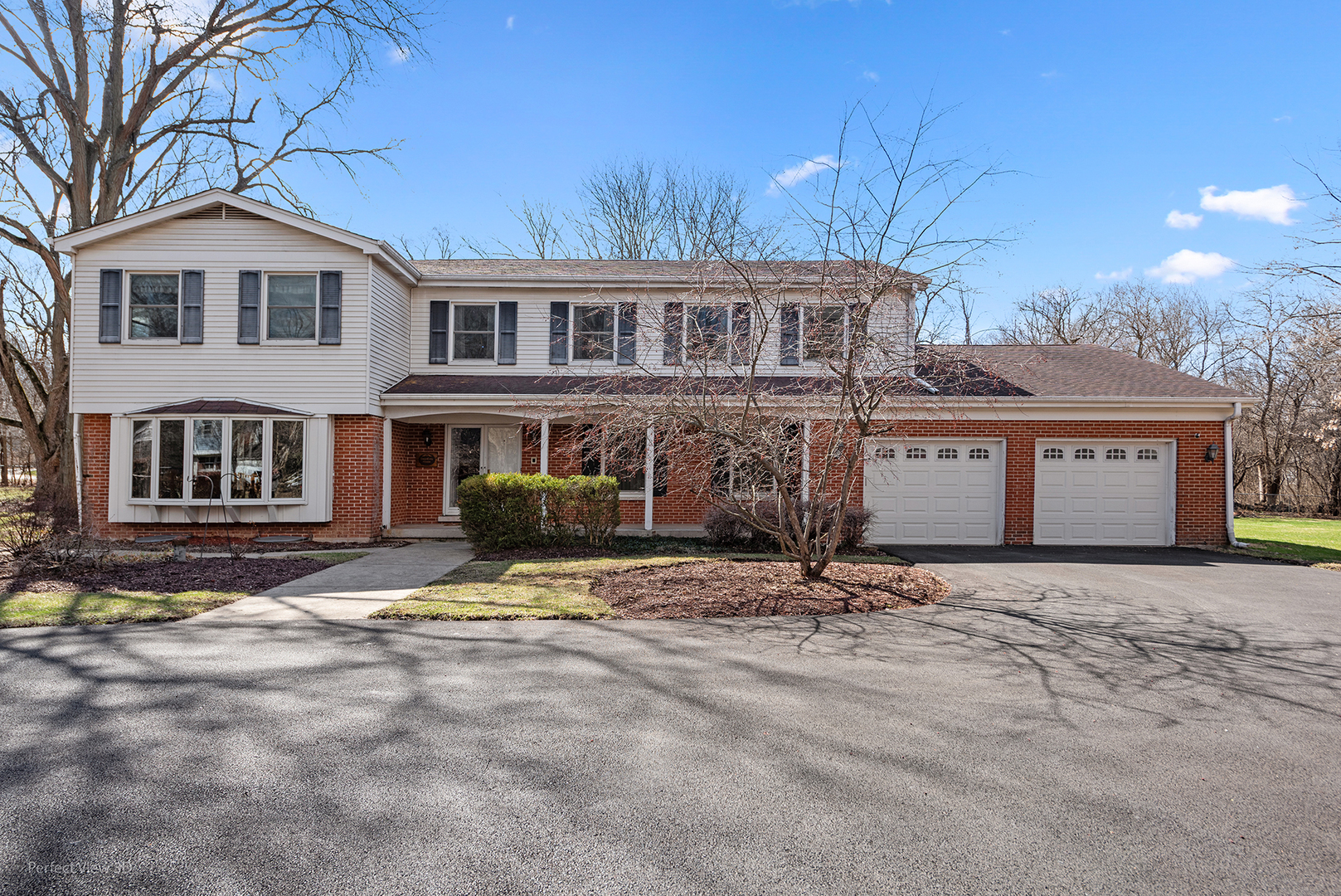 32-w050 Cedar Lane Wayne, IL 60184 - Photo 3 of 38 a view of a house with snow on the side of it