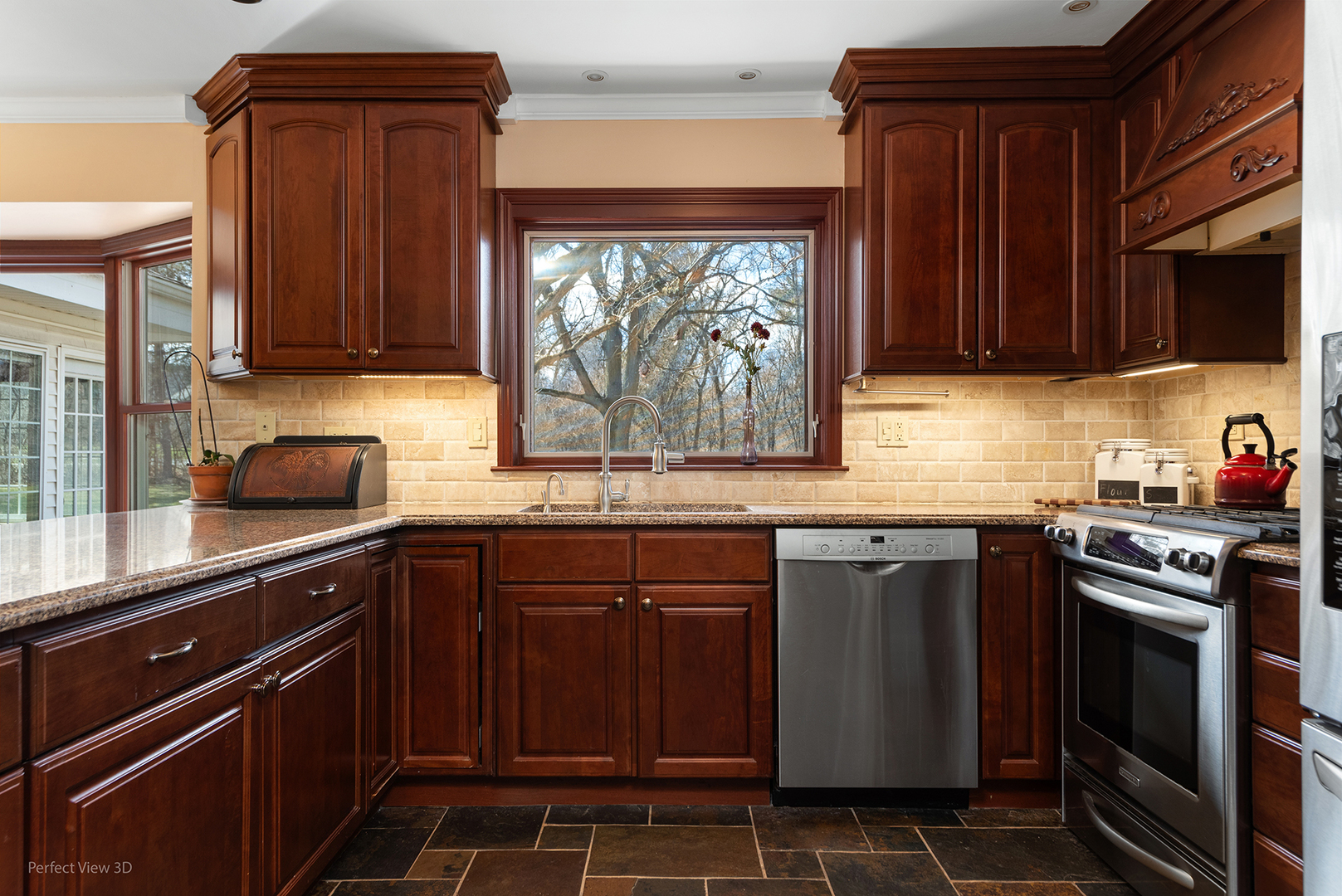 32-w050 Cedar Lane Wayne, IL 60184 - Photo 4 of 38 a kitchen with stainless steel appliances a stove a sink and a microwave