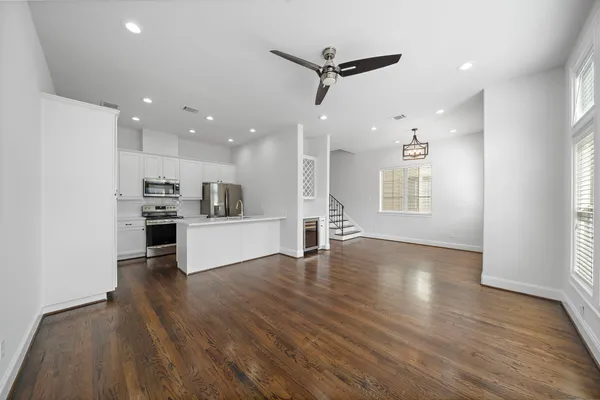 a view of kitchen with cabinets and wooden floor