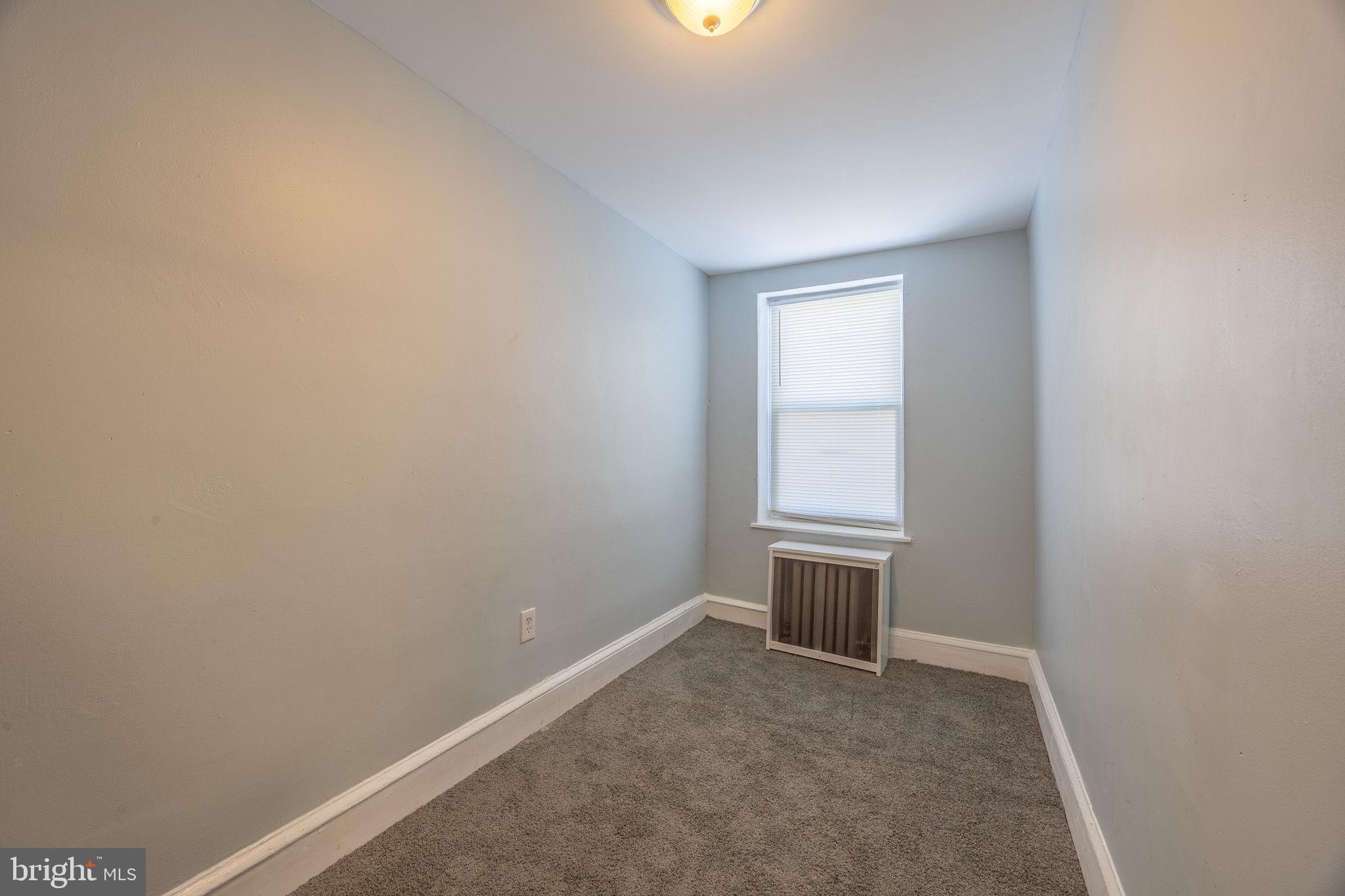 2403 South Edgewood Street Philadelphia, PA 19142 - Photo 23 of 31 a view of an empty room with a window