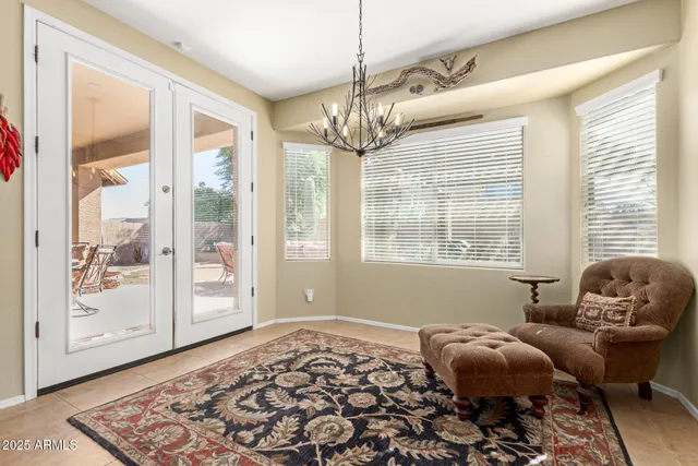 a view of a livingroom with a ceiling fan and window