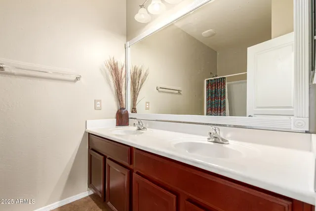 a white toilet sitting next to a bath tub
