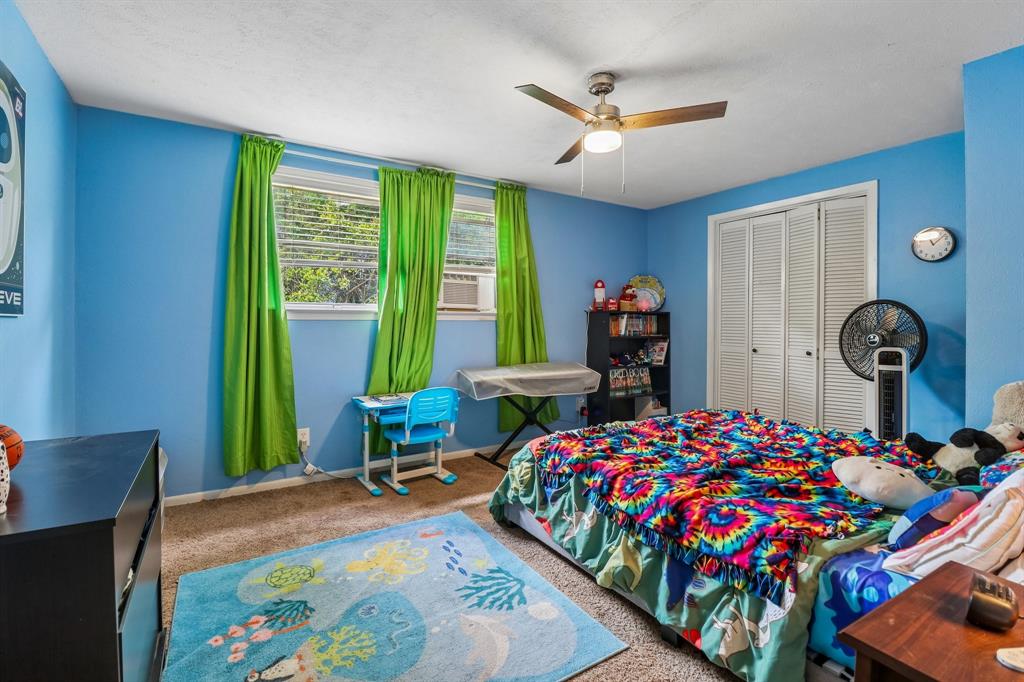 820 North Bowen Road Arlington, TX 76012 - Photo 35 of 40 a bedroom with bed and a large window