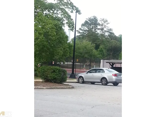 a view of a car parked in front of a house