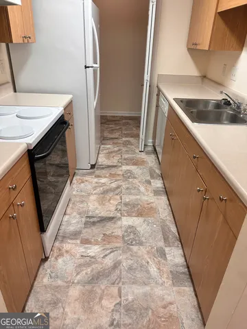 a view of a kitchen with a sink