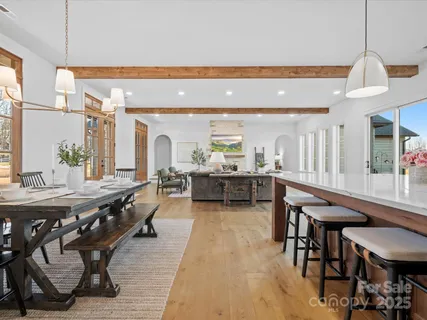 a living room with chairs and a table