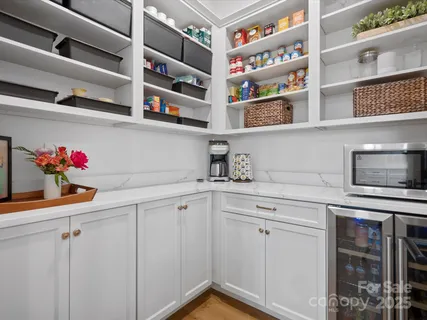 a kitchen with cabinets and window