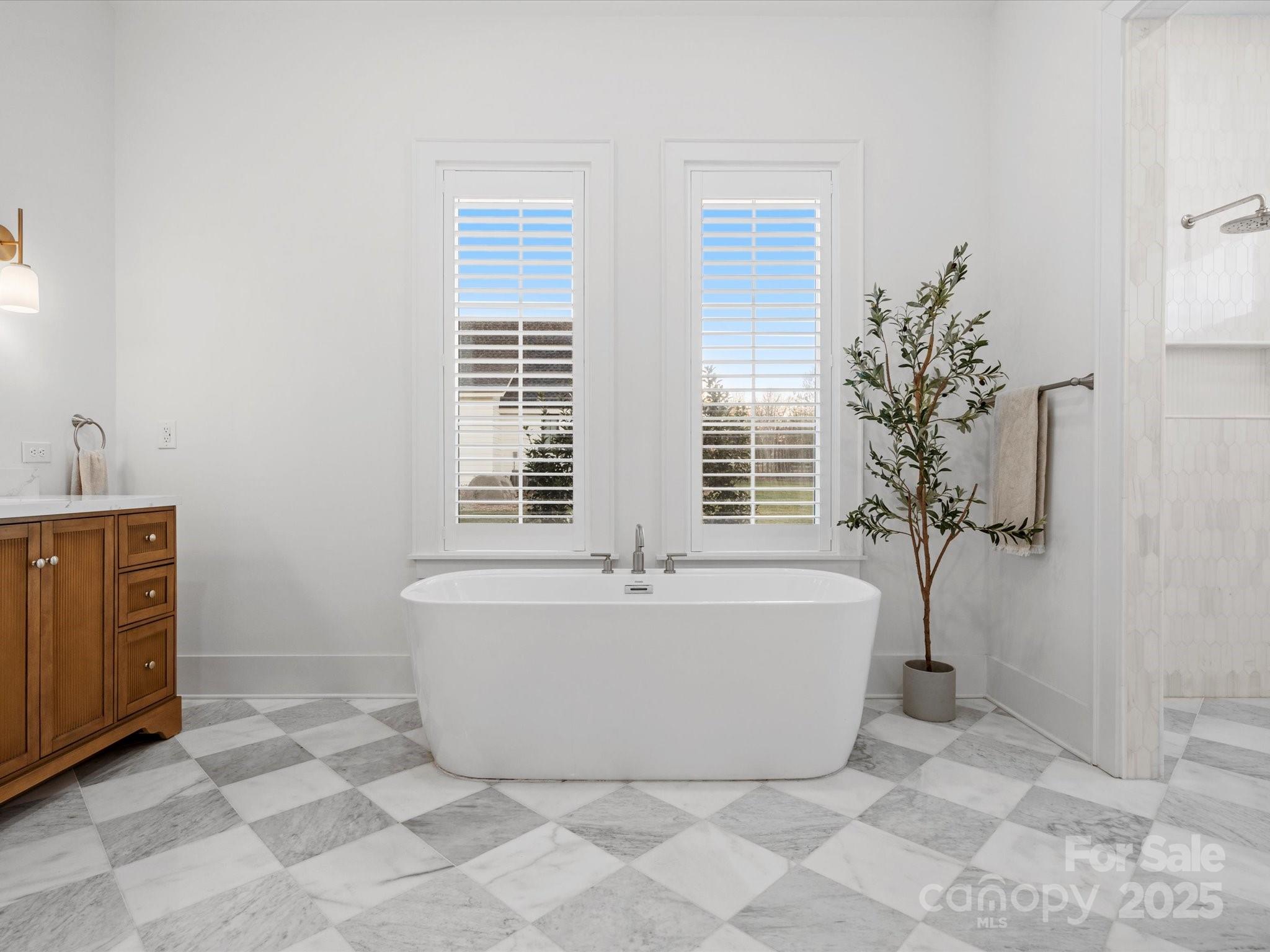 2370 Bridgewater Road Rock Hill, SC 29730 - Photo 32 of 47 a white bath tub sitting in a bathroom next to a window