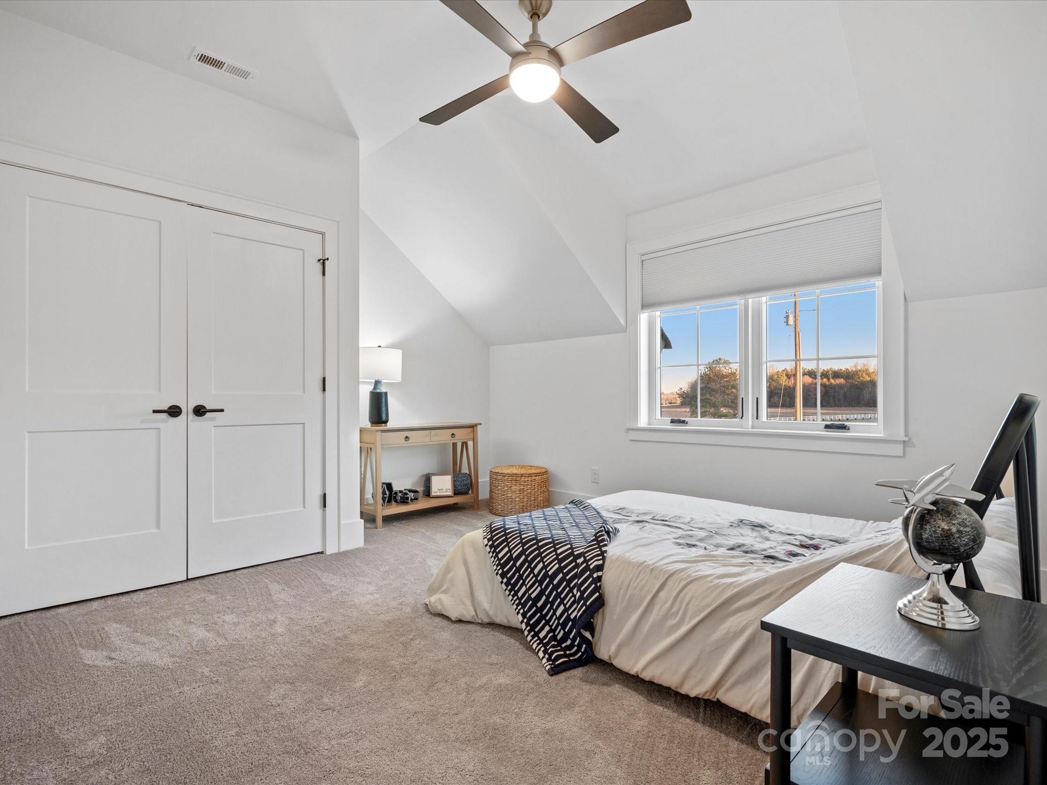 2370 Bridgewater Road Rock Hill, SC 29730 - Photo 41 of 47 a bedroom with a bed and a chandelier