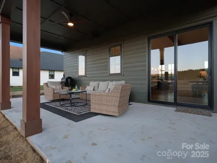 a living room with furniture and large window