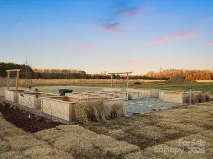 a view of a lake with houses in the back