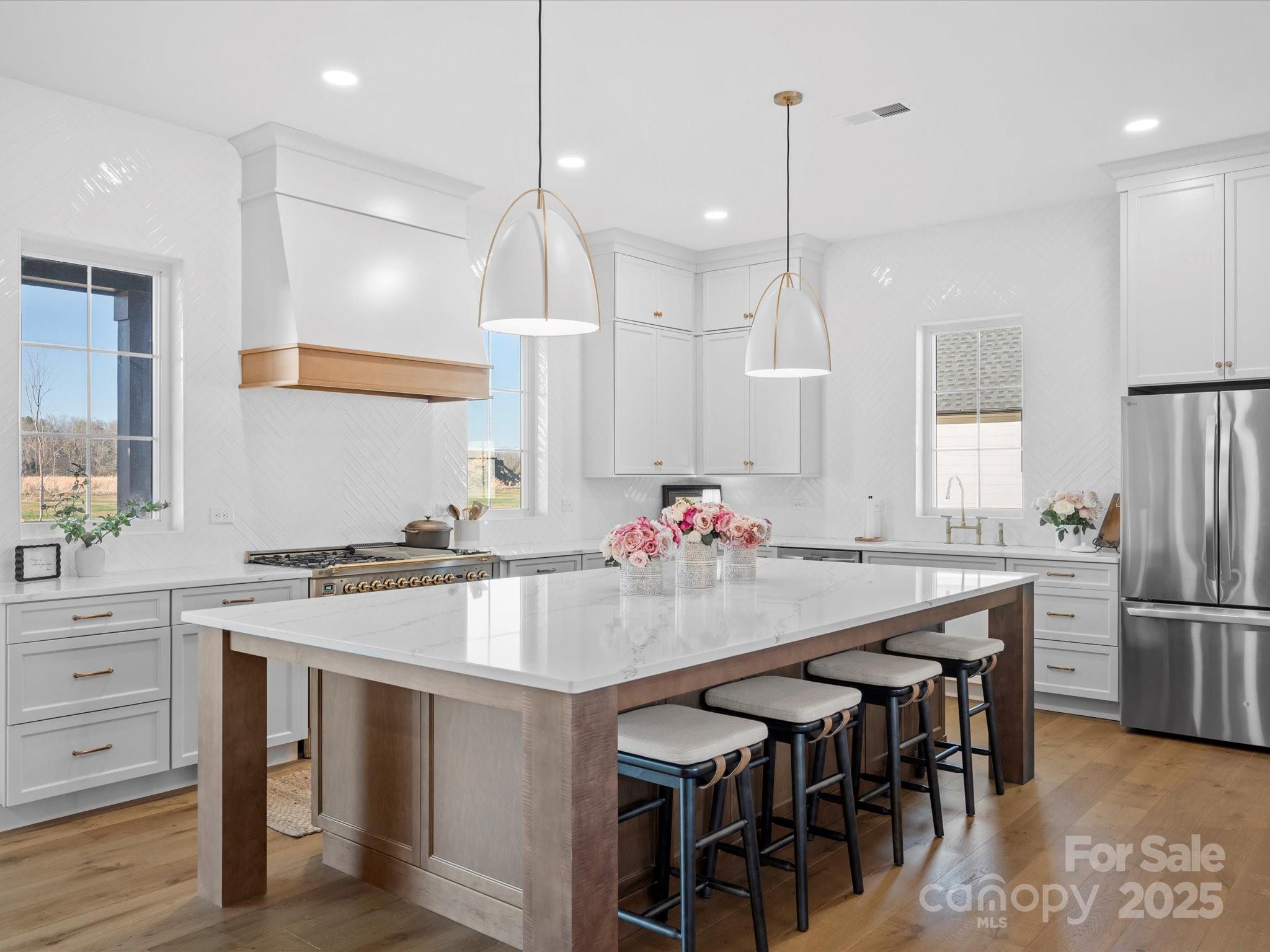 2370 Bridgewater Road Rock Hill, SC 29730 - Photo 7 of 47 a kitchen with kitchen island a table and chairs in it
