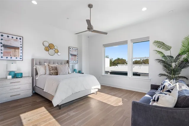 a bedroom with a large bed and a window