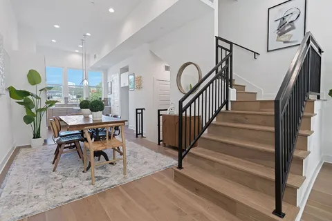 a workspace with wooden floor and furniture