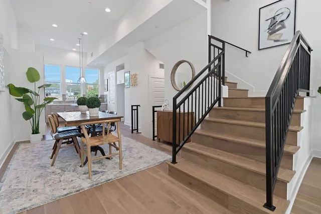a workspace with wooden floor and furniture