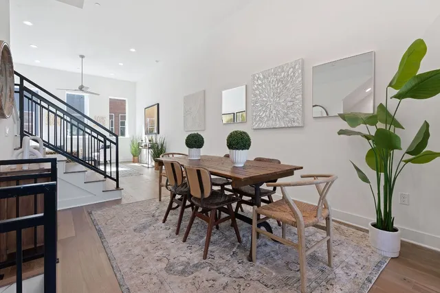 a view of a dining room and hall with furniture