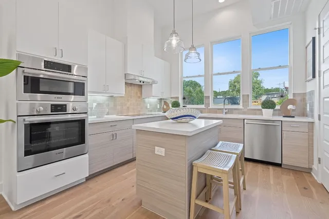 a kitchen with a sink stove and microwave