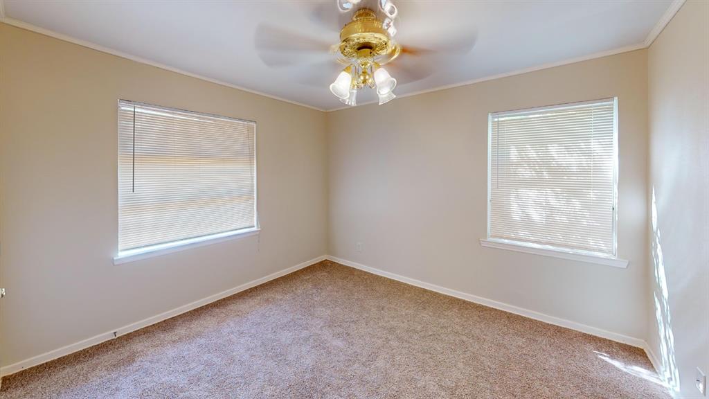 12225 Schroeder Road Dallas, TX 75243 - Photo 17 of 40 Neutral-toned walls complement carpeted flooring