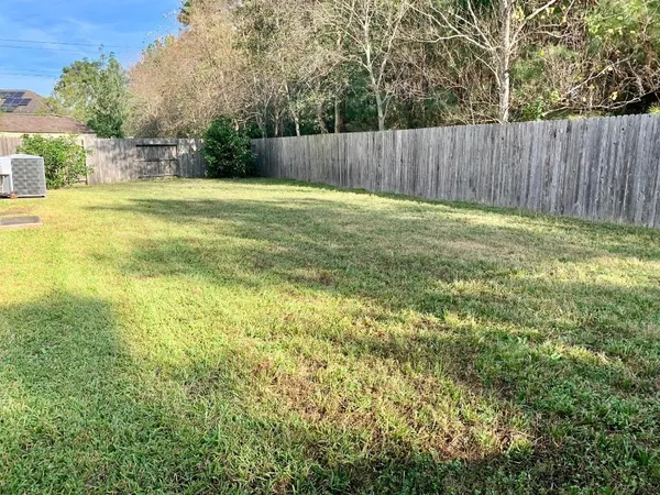 a view of a backyard with a small cabin