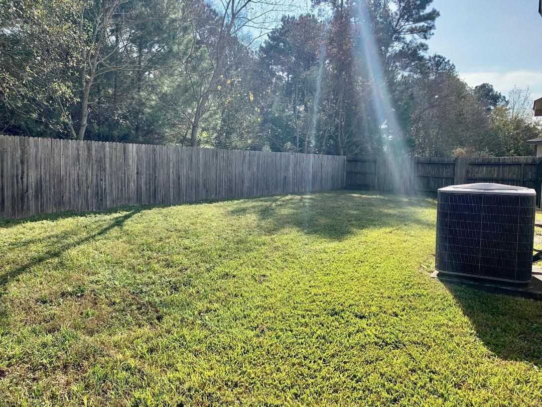 2902 Beacon Grove Street Spring, TX 77389 - Photo 20 of 22 a view of a backyard with a small cabin