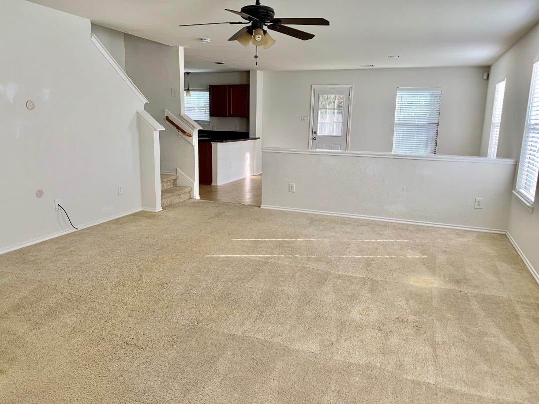 2902 Beacon Grove Street Spring, TX 77389 - Photo 6 of 22 a view of a livingroom with wooden floor and a ceiling fan