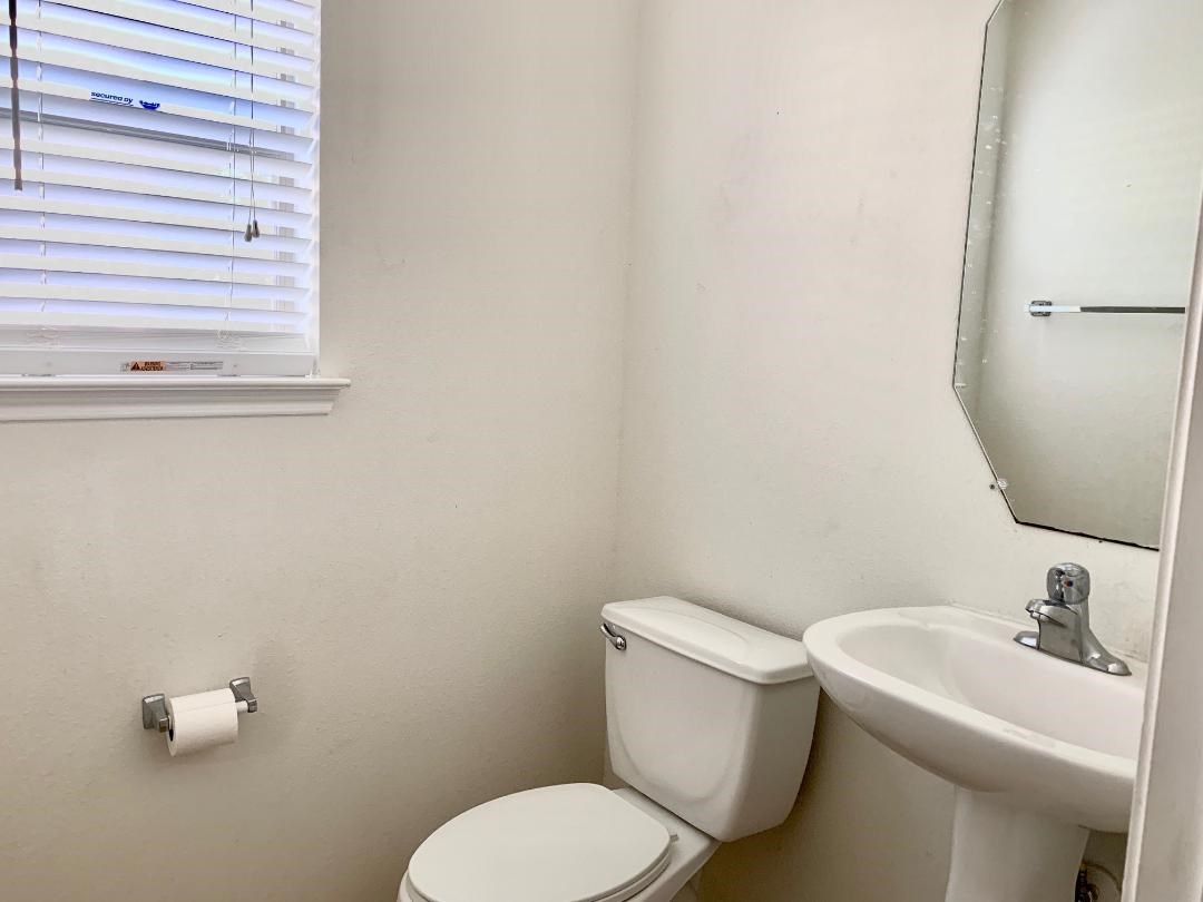 2902 Beacon Grove Street Spring, TX 77389 - Photo 10 of 22 a white toilet sitting next to a bathroom sink