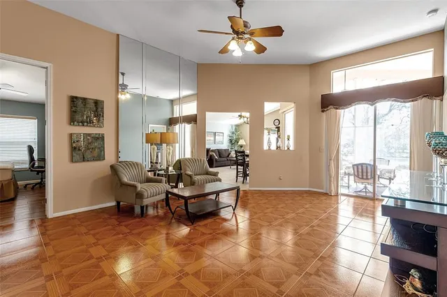 a bathroom with a granite countertop sink toilet a large mirror and shower