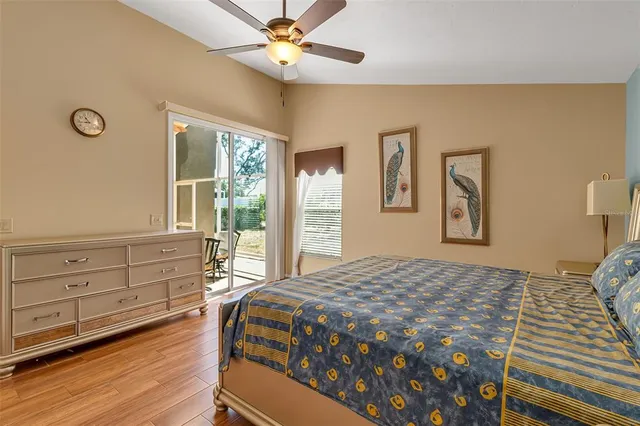 a bedroom with a bed and a table in it