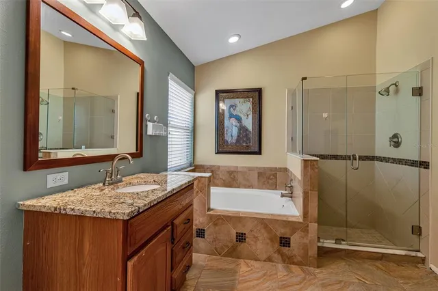 a front view of a house with a yard outdoor seating and garage