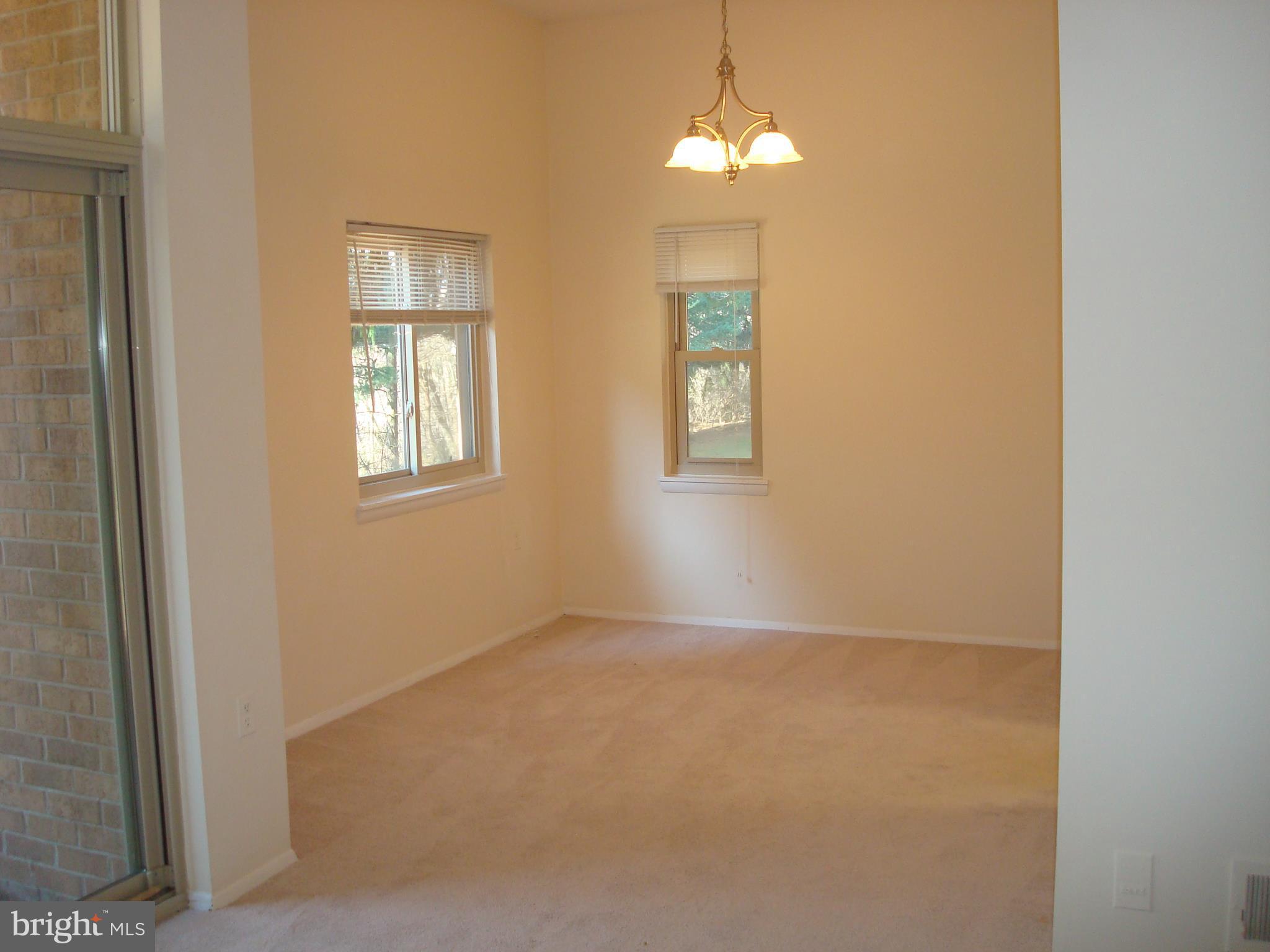 18612 Walkers Choice Road, Unit 2 Gaithersburg, MD 20886 - Photo 6 of 26 Dining room with 2 exposures