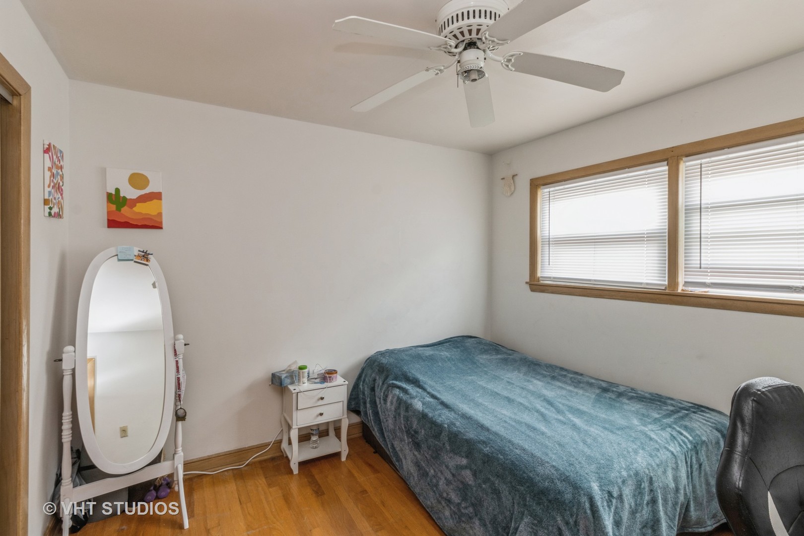 8517 West Foster Avenue Chicago, IL 60656 - Photo 11 of 21 a bedroom with a bed chair and window
