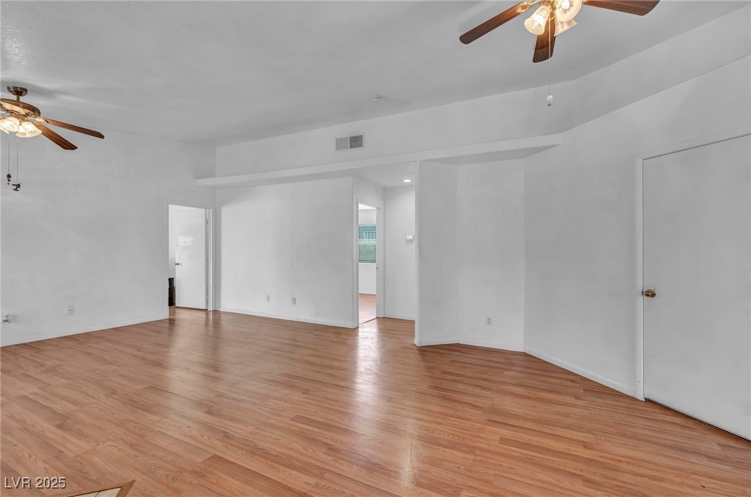 2165 St Paul Way Las Vegas, NV 89104 - Photo 13 of 45 Unfurnished room with ceiling fan and light wood-type flooring