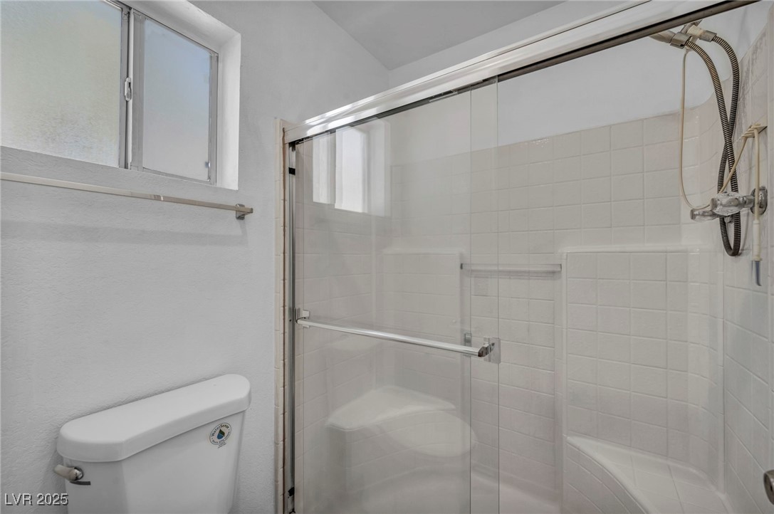 2165 St Paul Way Las Vegas, NV 89104 - Photo 31 of 45 Bathroom with toilet and a shower stall