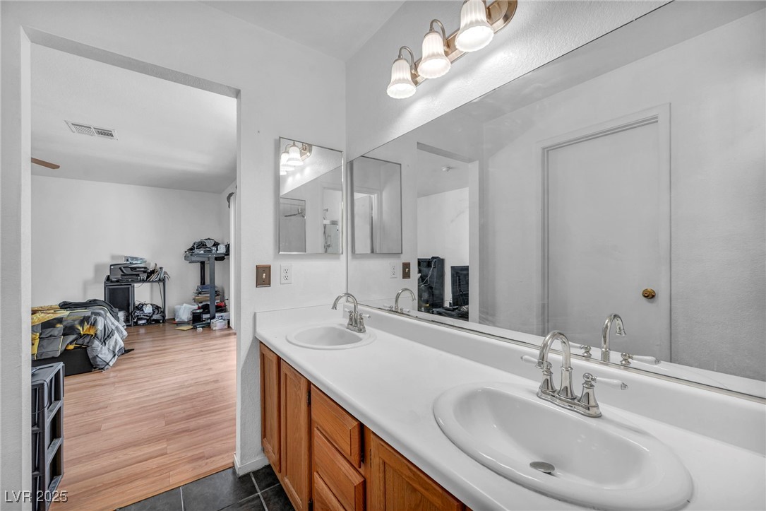 2165 St Paul Way Las Vegas, NV 89104 - Photo 32 of 45 Bathroom with double vanity and tile patterned floors