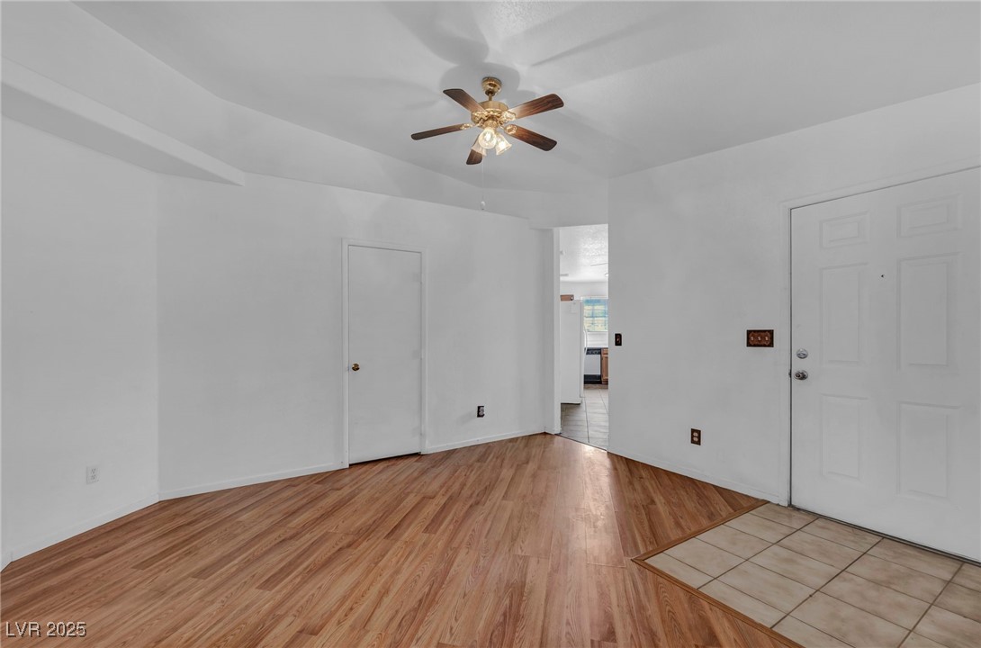 2165 St Paul Way Las Vegas, NV 89104 - Photo 6 of 45 Unfurnished room featuring a ceiling fan and light wood-style flooring