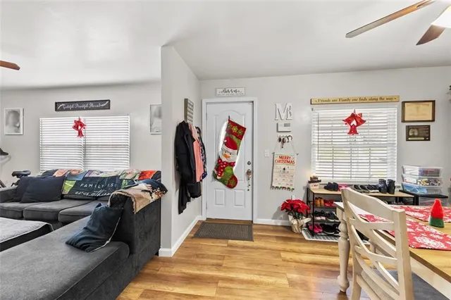 a view of a livingroom with workspace and a couch