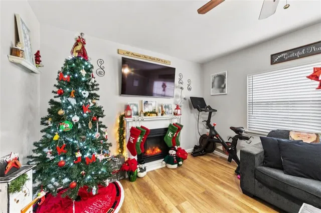 a living room with furniture and flowers