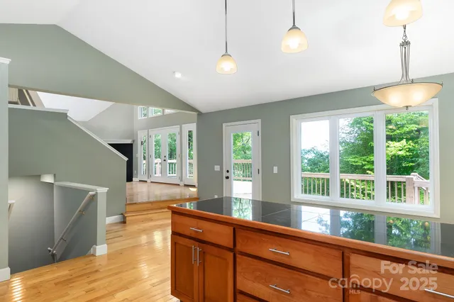 a view of living room with furniture and floor to ceiling windows